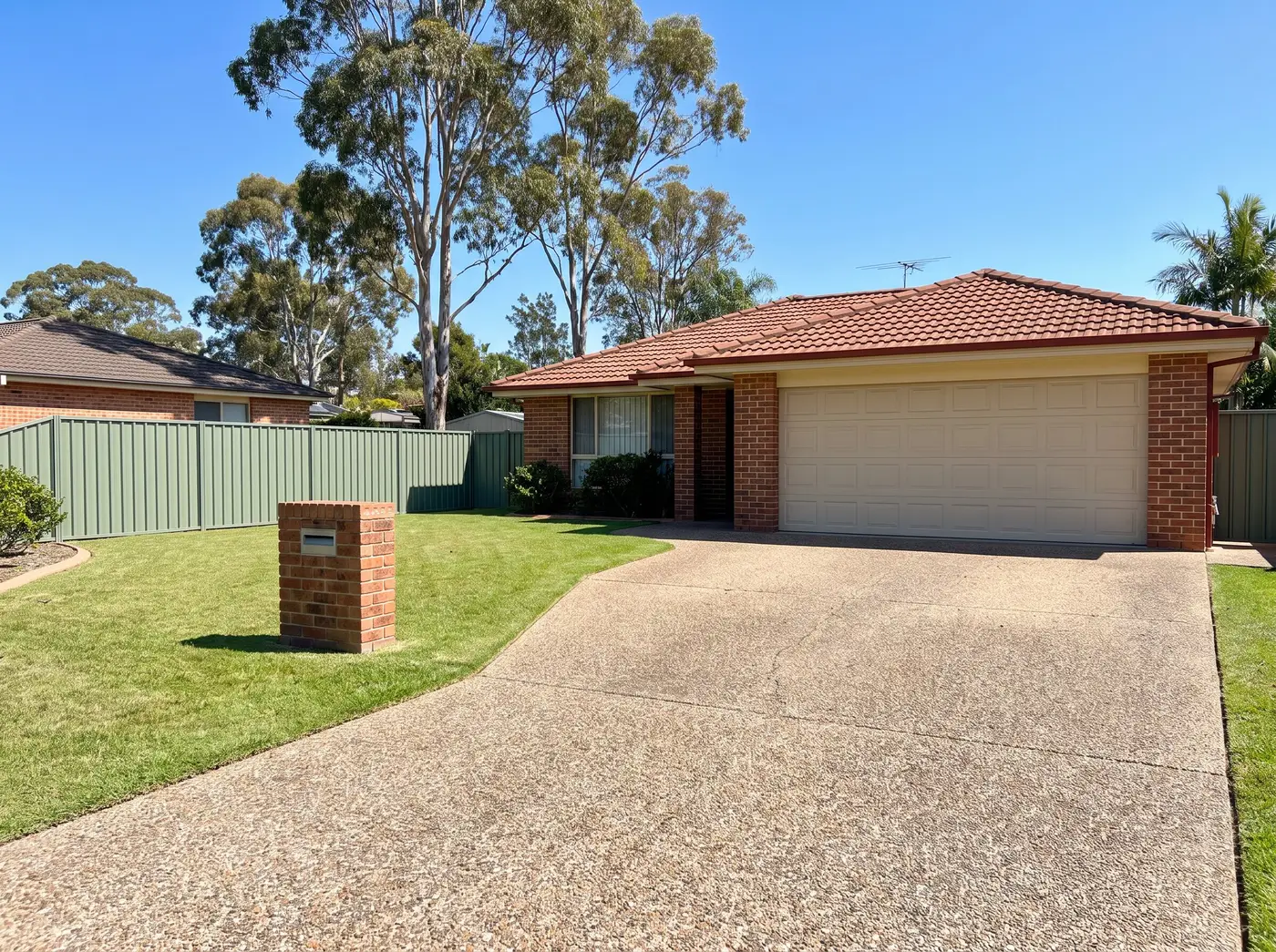 Concrete driveway in front of a Newcastle home